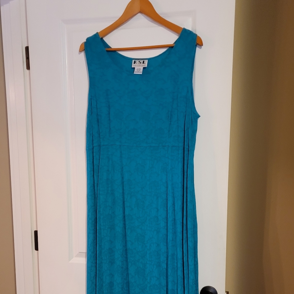 Two piece turquoise dress and jacket ensemble. Below knee length, lovely pattern